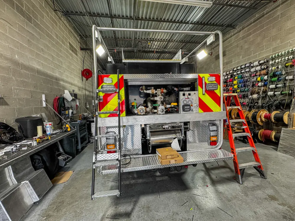 Apparatus in production bay with hood open, photo 51 of 303.